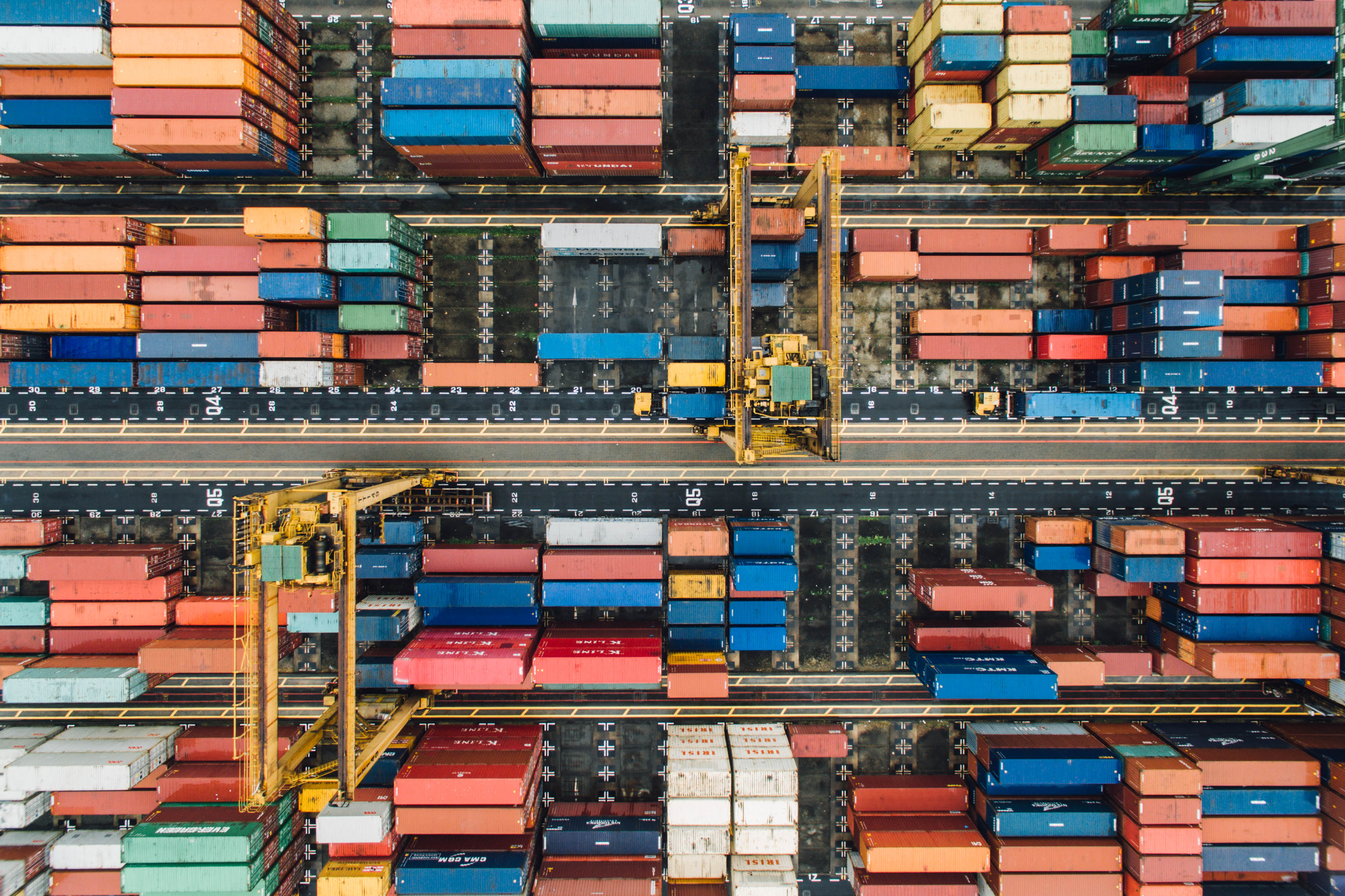 Aerial view of shipping containers at a port — representative logistics photograph
